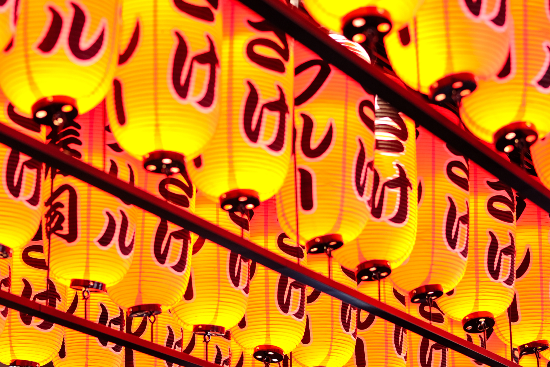 A close up at Asian-inspired lights inside of Blue Sushi. 
