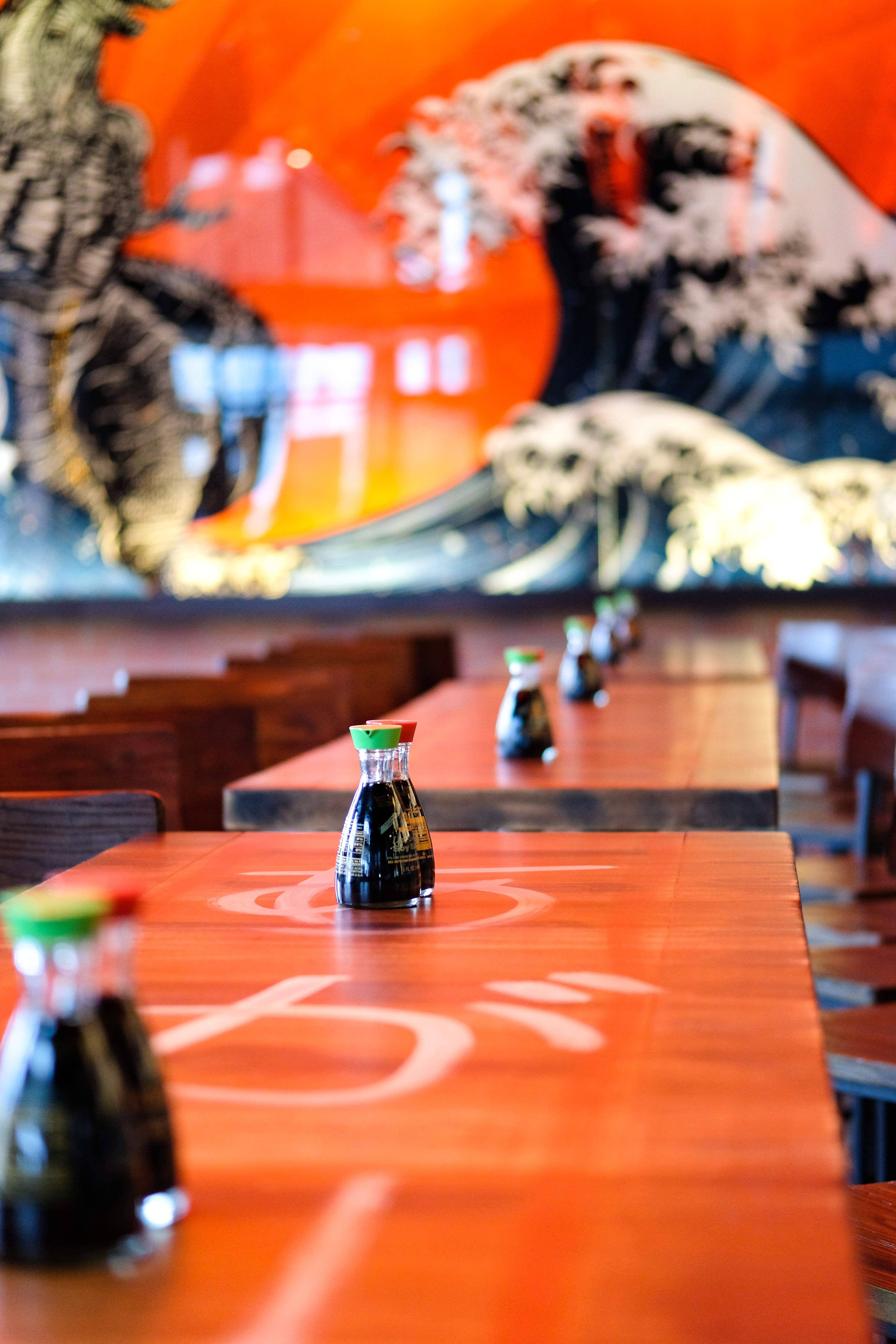 Soy sauces lined up on a table. 